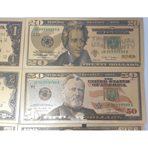 776 - 8x gold plated US dollars assorted denominations