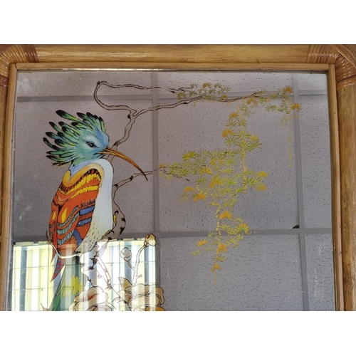 840 - Large wood framed mirror incorporating a bird design.