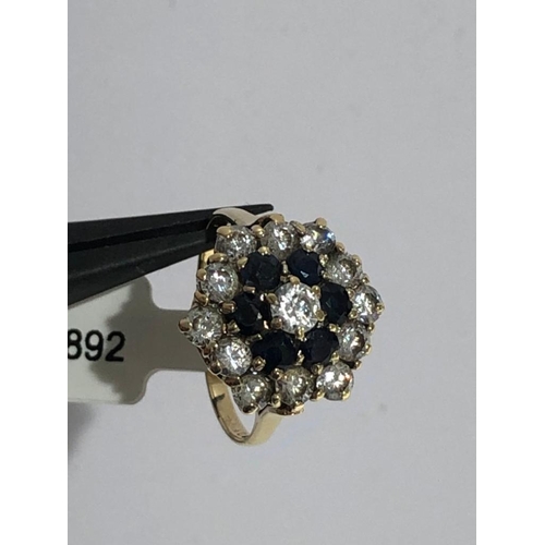 662 - Cluster ring in 9K gold with cz and sapphires. Size N1/2 and weighs 3.3g.