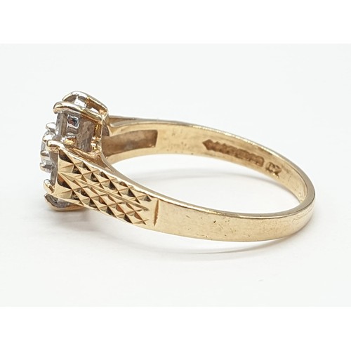 859 - 9ct Gold cluster ring ,having chased design work to shoulders. Boxed. Weight 2.3 grams approx. Size ... 