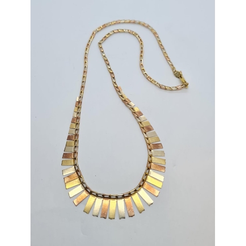 215 - A necklace and earring set, multi-coloured 9ct gold. 10g in weight.