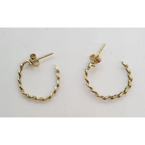 216 - Pair of 9ct gold small hoop earrings. Attractive pierced link design. 1.1 grams approx.