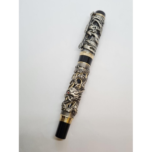 244 - Jinhao dragon pen in black. Having a dragon and birds in relief work to outer case. 18ct gold plated... 