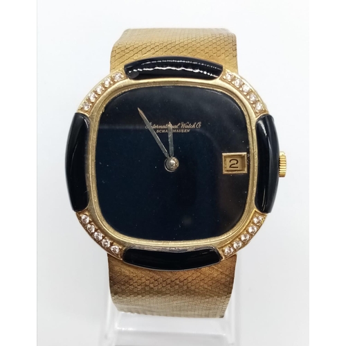 33 - IWC Schaffhausen 18ct gold watch with black face, diamond and enamel bezel, 17.5cm long approx, 35mm... 