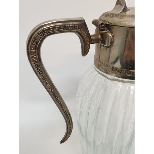 348 - An Edwardian large claret bottle with a decorative spout and handle. Art deco design. 32cm in height... 