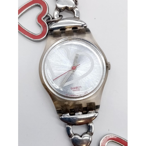 401 - SWATCH LADIES FASHION WATCH WITH HEART DETAILS DECORATING ON FACE AND STRAP, 22CM CASE (NEW BATTERY ... 