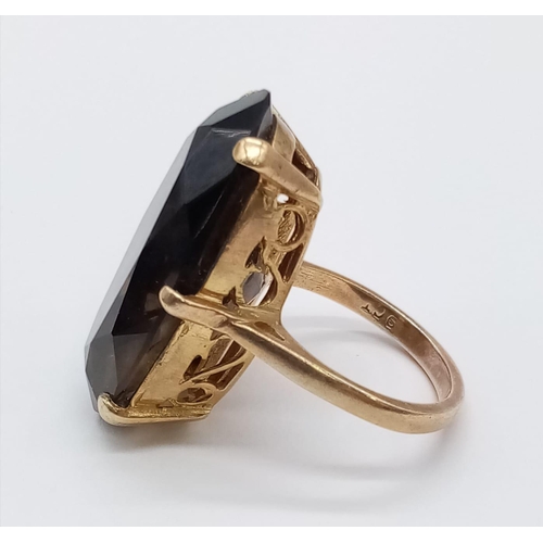 717 - 9ct vintage ring with large smoky quartz, size U and weight 8.75g