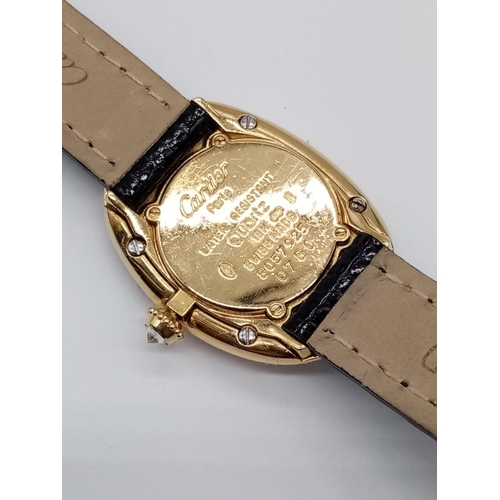 73 - Vintage 18ct gold Cartier ladies quartz watch with oval face and diamond encrusted bezel, Cartier bl... 