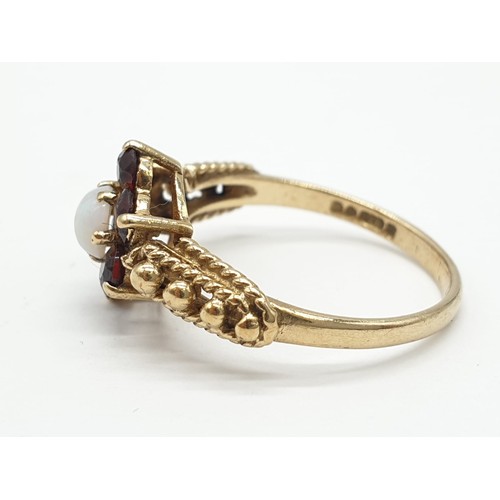 123 - Vintage 9ct gold garnet and Opal ring ,having Gold beads to shoulders. Full London Hallmark for 9ct ... 