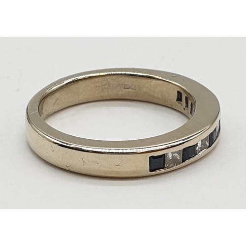 28 - 18ct White gold half eternity ring with inset sapphire and diamonds, 4.9g and size K.