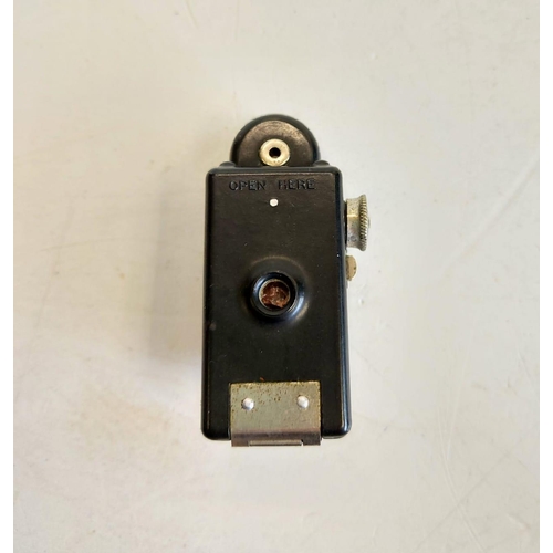 136 - A midget Coronet spy camera, circa 1930's. 3x6cm.