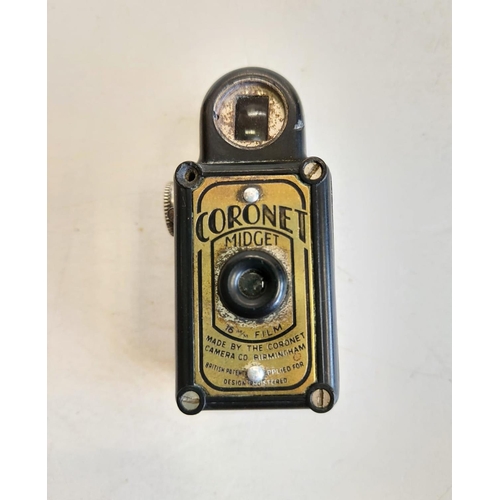 136 - A midget Coronet spy camera, circa 1930's. 3x6cm.