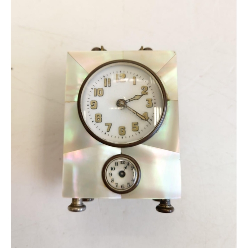 137 - German mother of pearl cased alarm clock, with twin face. 5x6cm.