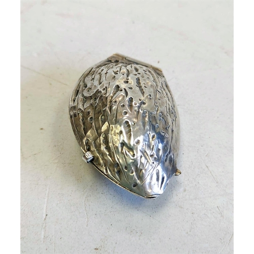 144 - A hallmarked silver pill box, shaped like an almond. 5cm long and 16g.