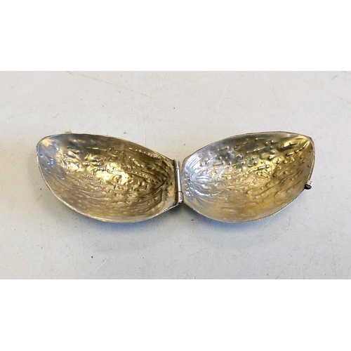 144 - A hallmarked silver pill box, shaped like an almond. 5cm long and 16g.