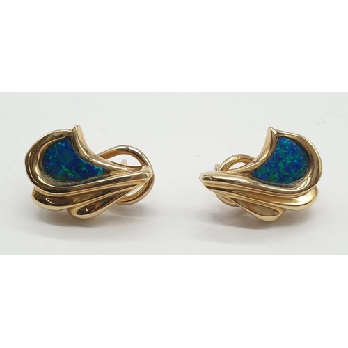 149 - A pair of 14ct gold earrings with turquoise inlays. 8.4g.