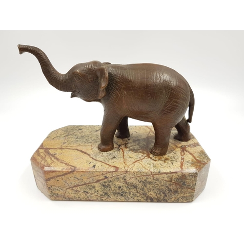 263 - 3 Vintage elephant figurines. 1 ceramic, made in France by Sevres, the other two are brass; one of w... 