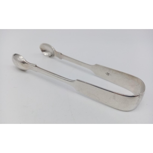 349 - A Victorian sterling silver spoon - designed tong set. Fantastic condition. 14cm in length. 56g in w... 