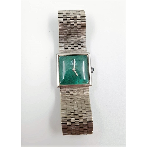 625 - A Milner ladies watch, stainless steel strap and emerald face. Comes with case.