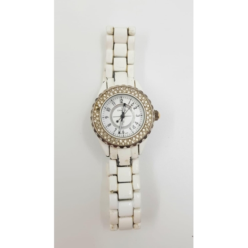 709 - A Chanel 112 styled swiss made ladies watch - white ceramic bracelet. As found.