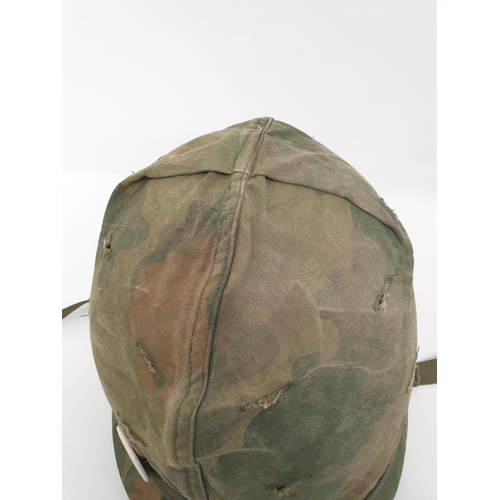 76 - Vietnam War Era US M1 Helmet with Reversible Mitch-Duck Hunter Cover. The peace pin may be post war.