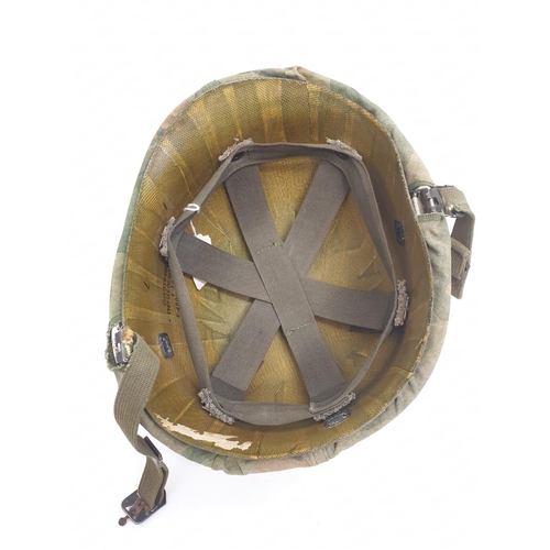 76 - Vietnam War Era US M1 Helmet with Reversible Mitch-Duck Hunter Cover. The peace pin may be post war.