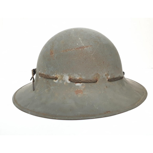 46 - WW2 Zuckerman Helmet. Marked with the Allen West Factory Logo. This company made Mills grenades duri... 