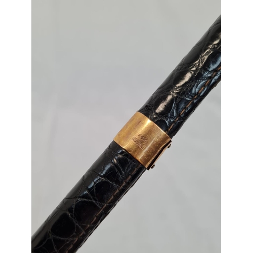 264 - A vintage 'Fox' manufactured umbrella with crocodile skin handle and 18ct gold plate trim. 86cm leng... 