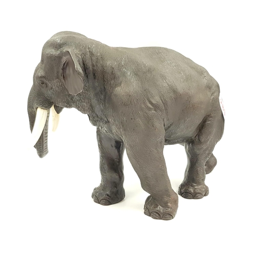 289 - A beautiful bronze elephant sculpture (circa 1930) with ivory tusks, Japanese marked, 35cm long x 26... 