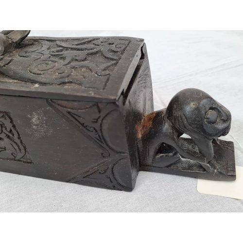 599 - Carved tribal box with sliding lid, 42x8cm