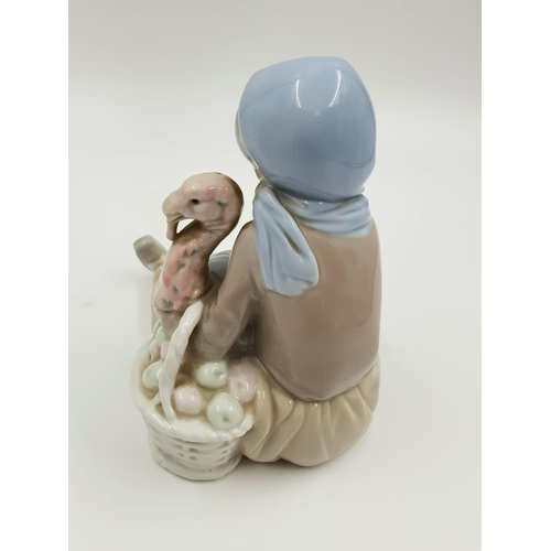 895 - A ceramic elephant, dog and a woman caressing a turkey (pre thanksgiving).