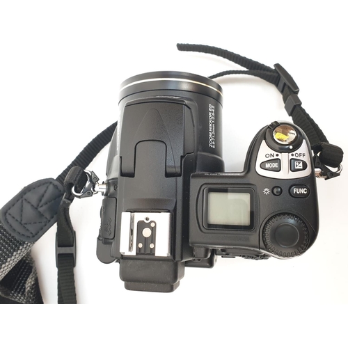 763 - A Nikon Coolpix 5700 digital camera. Includes charger, lens cap and case. As found.