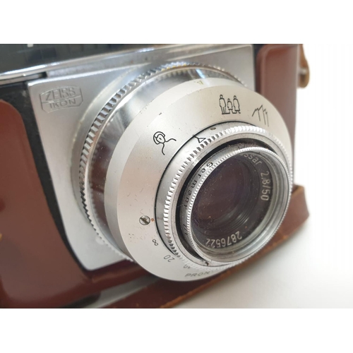 772 - A Zeiss Ikon Tenax automatic 50mm camera. Good condition with case. As found.