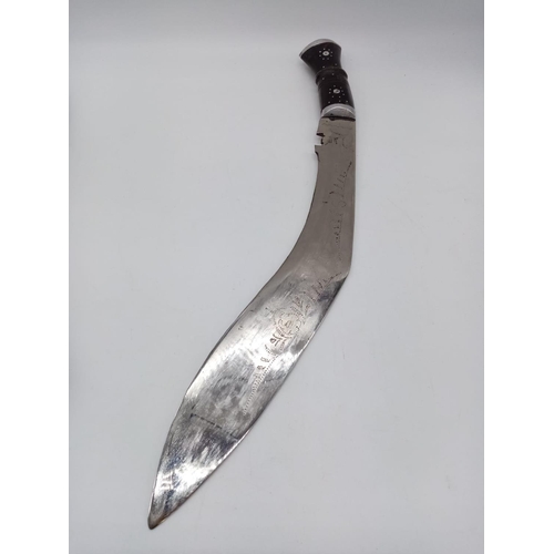 342 - A large Gurkha vintage kukri knife with patterned inscription on blade, with scabbard. 50cm long.