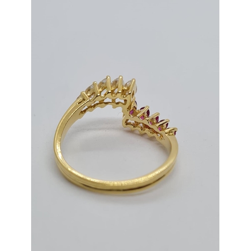 42 - 18ct yellow gold diamond and ruby ring, weight 3g and size N