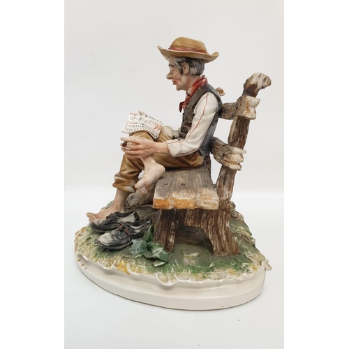 980 - A Capodimonte figure of an old man drying his socks.  22cm height x 28cm diameter.