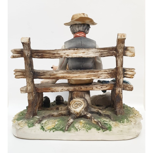 980 - A Capodimonte figure of an old man drying his socks.  22cm height x 28cm diameter.