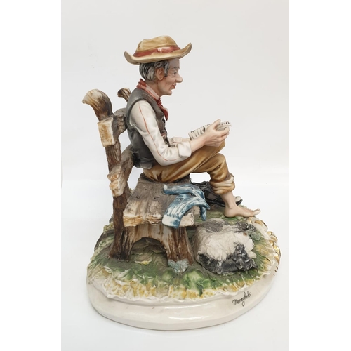 980 - A Capodimonte figure of an old man drying his socks.  22cm height x 28cm diameter.