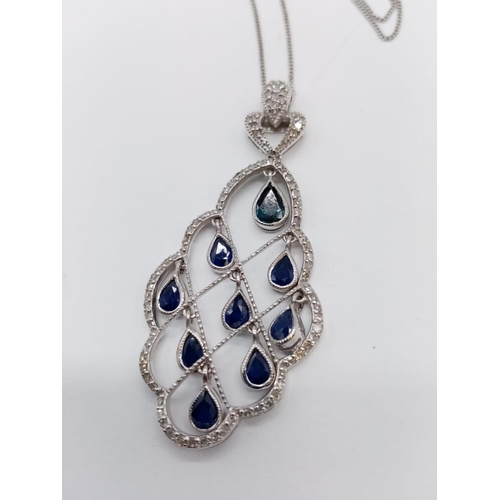 935 - 18CT DIAMOND AND SAPPHIRE PENDANT ON A 42CM CHAIN, WEIGHT 7.4G