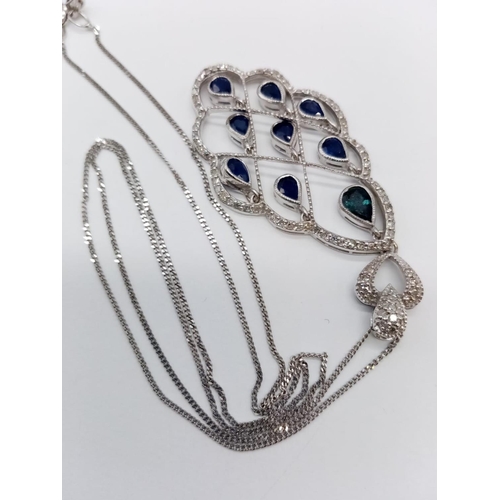 935 - 18CT DIAMOND AND SAPPHIRE PENDANT ON A 42CM CHAIN, WEIGHT 7.4G