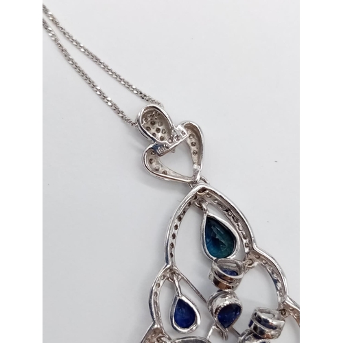 935 - 18CT DIAMOND AND SAPPHIRE PENDANT ON A 42CM CHAIN, WEIGHT 7.4G