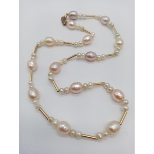 960 - 9ct necklace with fresh water pearl. 48cm in length. 24g in weight.