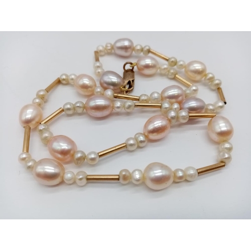 960 - 9ct necklace with fresh water pearl. 48cm in length. 24g in weight.