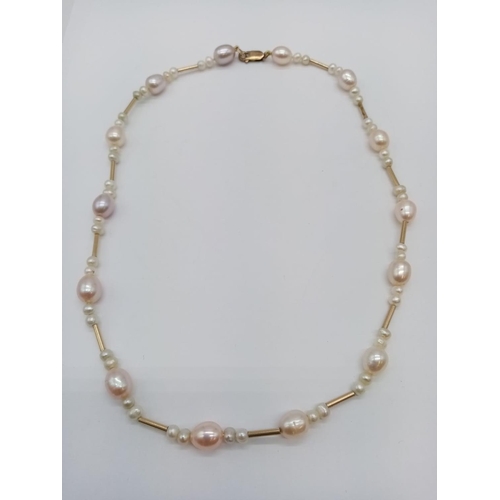 960 - 9ct necklace with fresh water pearl. 48cm in length. 24g in weight.