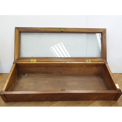 359 - A Victorian display cabinet with glass top. 90cm x 30cm.