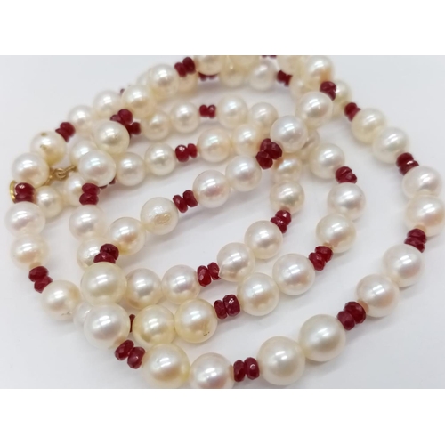 961 - Cultured pearl and ruby necklace. 46cm in length. 16.6 grams in weight.