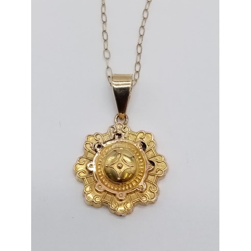 966 - Antique 9ct gold pendant on chain. 44cm in length. 1.2g in weight.