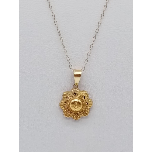 966 - Antique 9ct gold pendant on chain. 44cm in length. 1.2g in weight.