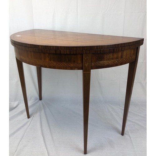 27 - A late Victorian Semi circular table that opens up into a card table with leather top, nicely inlaid... 