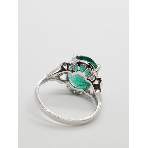 34 - 18ct white gold with 4ct emerald and diamond ring, weight 4.2g and size N